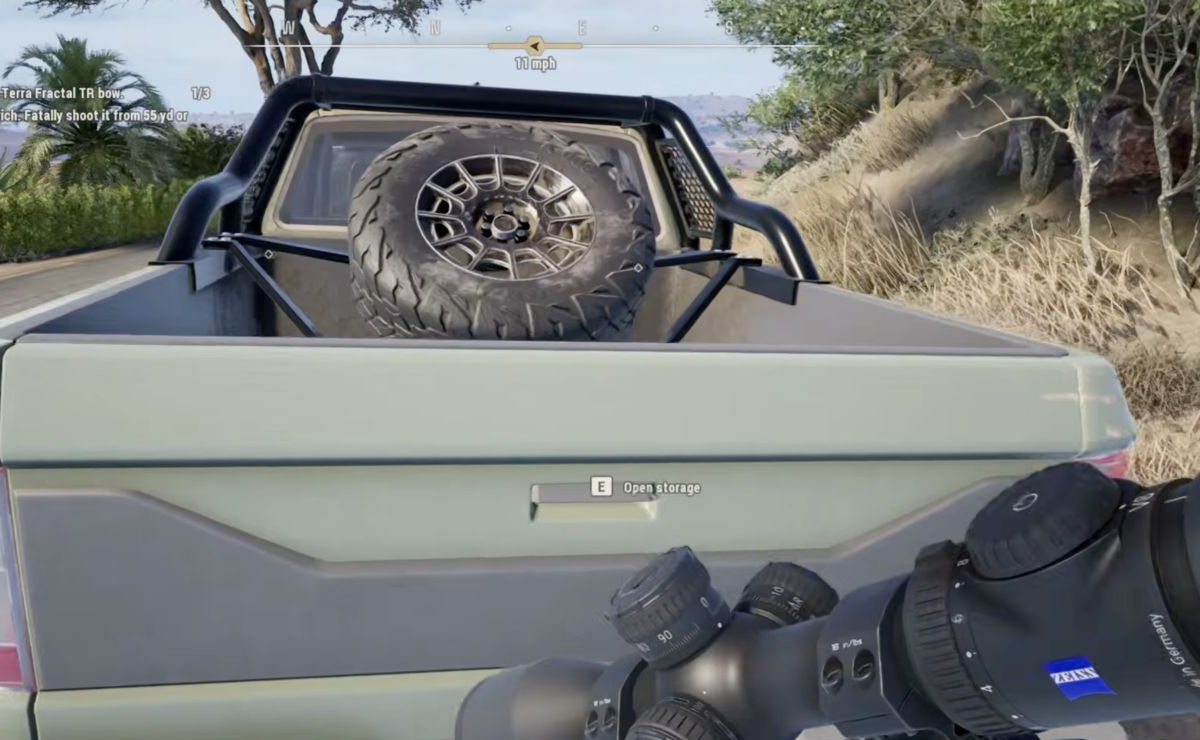 Truck tailgate with the E Open storage interaction prompt.